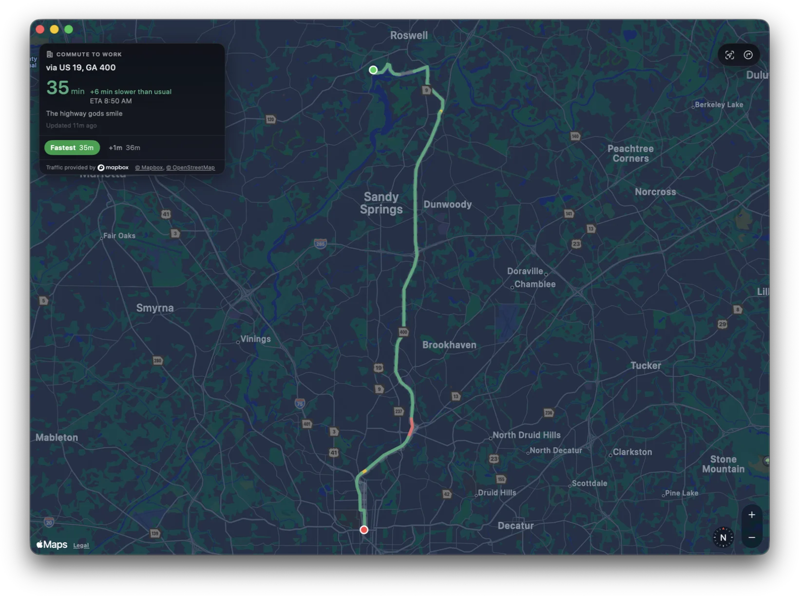 The same Traffic Map window in dark mode, the route from Roswell into Atlanta drawn on the map with its floating summary panel